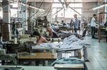 Tailors work in a textile factory north of Cairo.