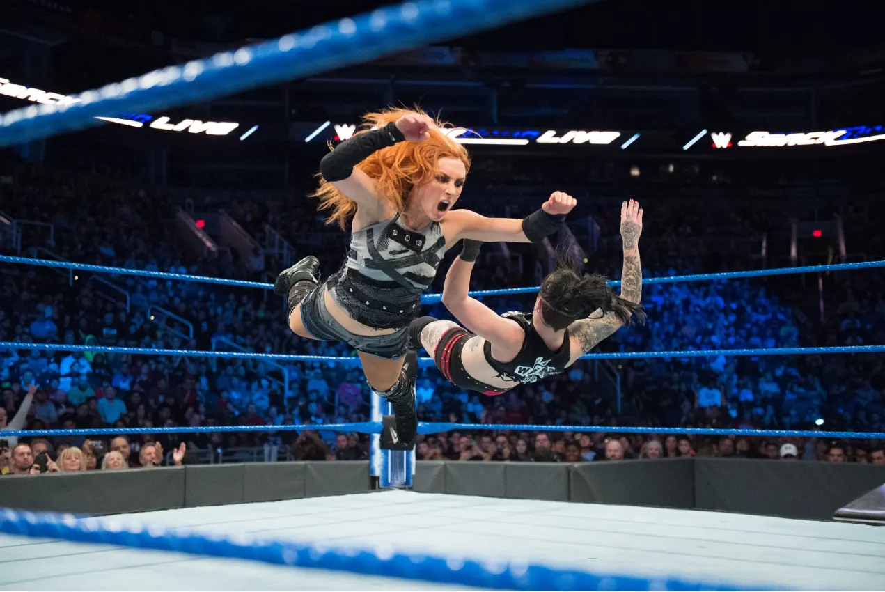 WWE superstar Becky Lynch, whose nickname is ‘The Man,’&nbsp;flies through the air during a match.&nbsp;