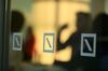 Deutsche Bank AG logos sit on a glass panel during the German Institute for Economic Research in Berlin (DIW) women's finance summit, inside Deutsche Bank's offices in Berlin, Germany, on Tuesday, May 23, 2017. Germany's business confidence rose to the highest since 1991 this month, while manufacturers saw the fastest growth in six years amid a surge in orders.