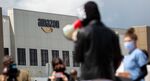 A fired Amazon fulfillment center employee, center, speaks during a protest outside an Amazon.com facility in the Staten Island borough of New York in 2020.