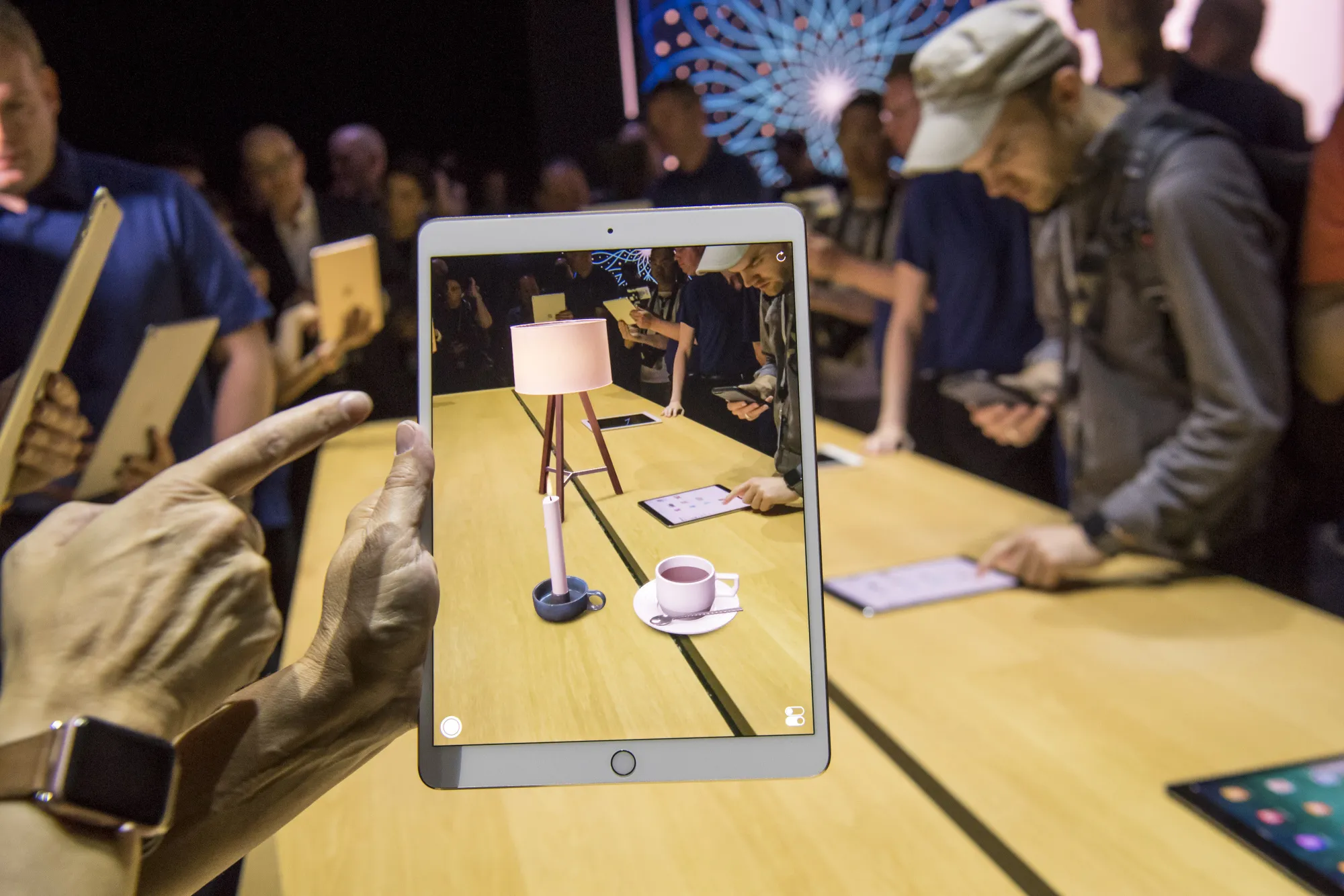 An attendee demonstrates the ARKit, augmented reality tool, on an Apple Inc. iPad Pro.