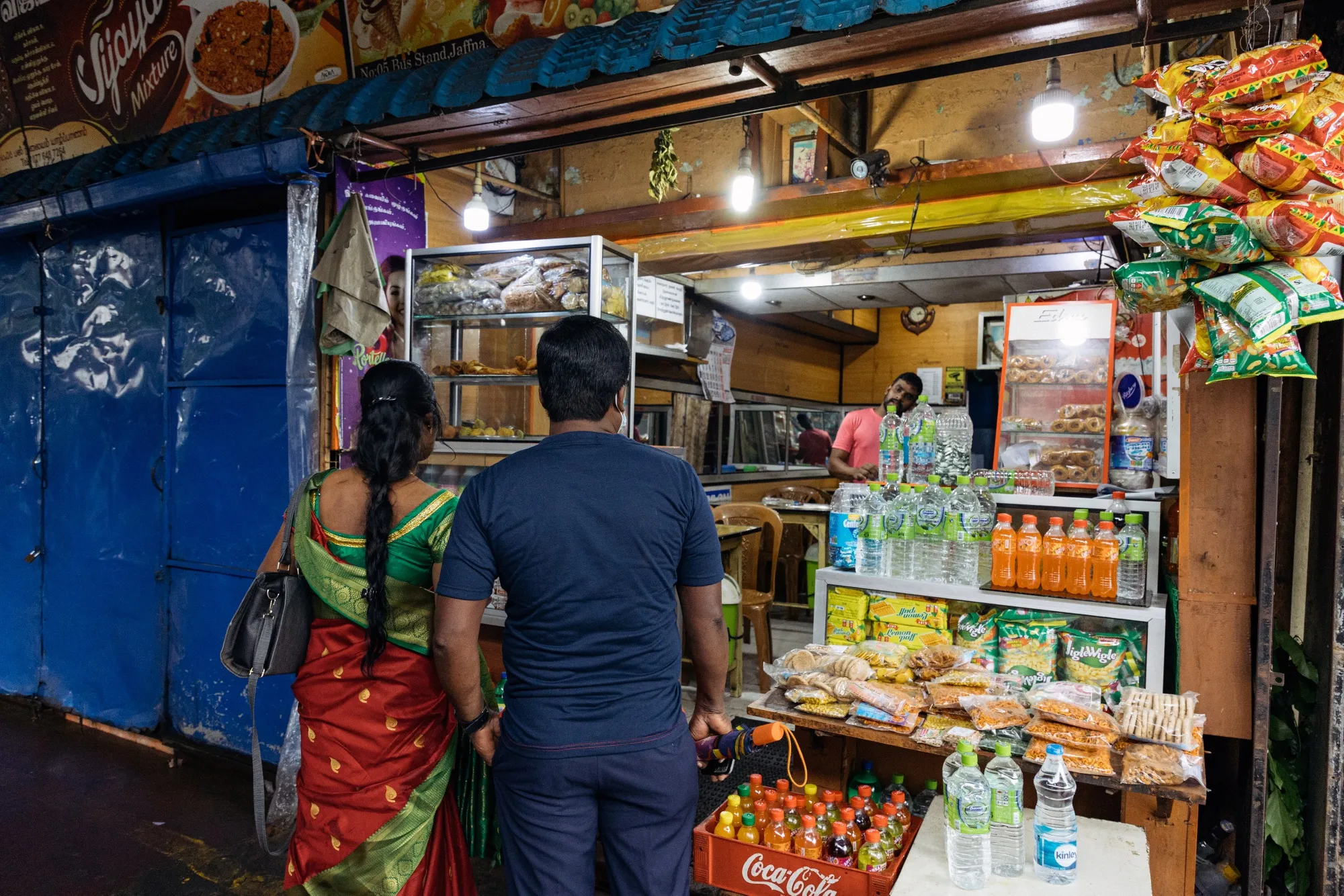 Shoppers at a snack stall in Jaffna, Sri Lanka, on Monday, Oct. 24, 2022. Sri Lanka’s 70% inflation is hitting its peak as crippling shortages ease and bailout funds look within reach, yet it’s far from putting the central bank governor at ease.