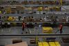 Employees pull carts containing online orders at the Amazon.com Inc. fulfillment center in Robbinsville, New Jersey.