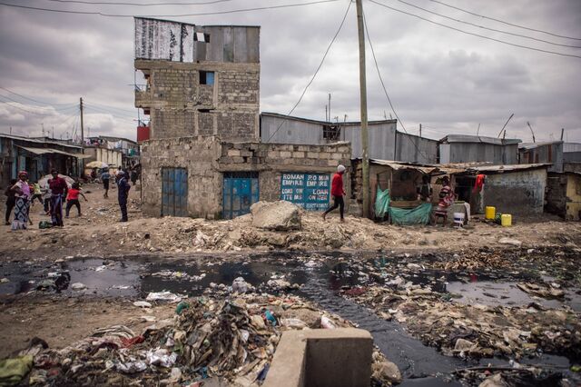 Ink-black wastewater mixes with discarded trash in Mukuru.