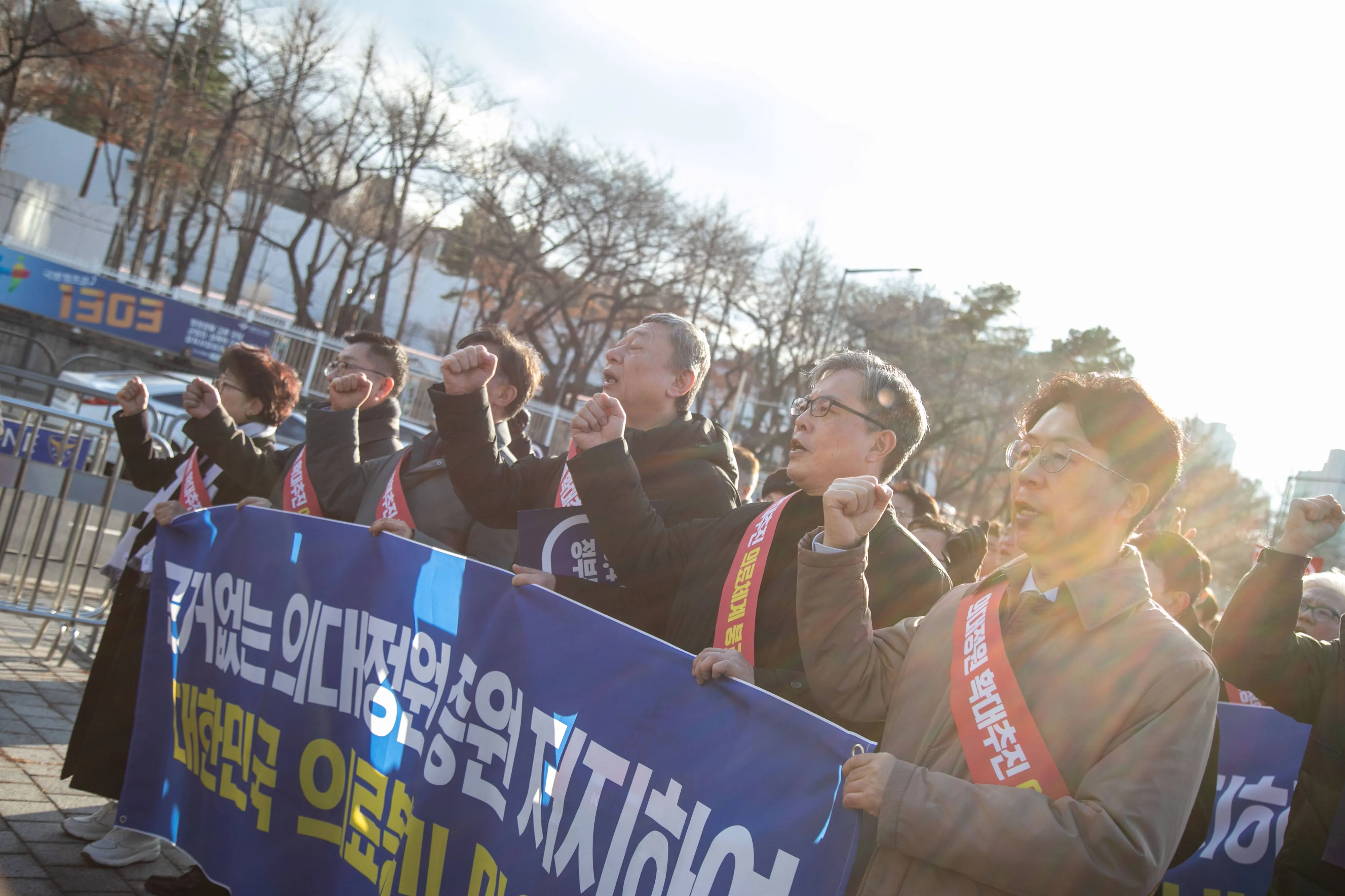 Demonstrators march during a protest against a government plan to increase the number of seats at medical schools in Seoul on Feb. 25.
