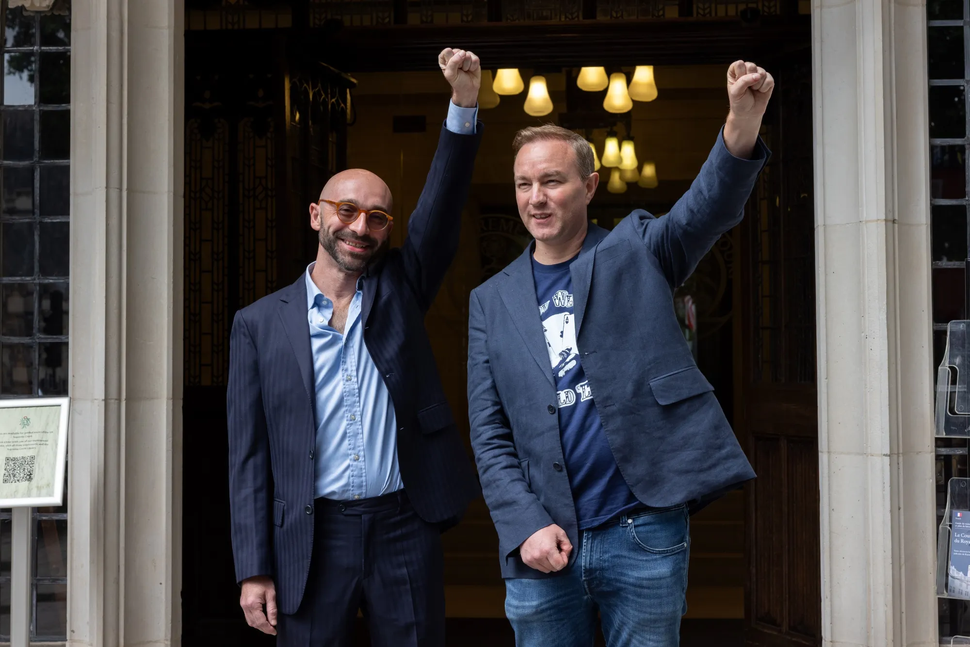 Tom Hayes&nbsp;and Carlo Palombo celebrate outside the Supreme Court in London.