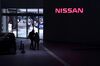 Pedestrians pass signage for Nissan Motor Co. at the company's headquarters in Yokohama, Japan, on Thursday, Jan. 9, 2020.