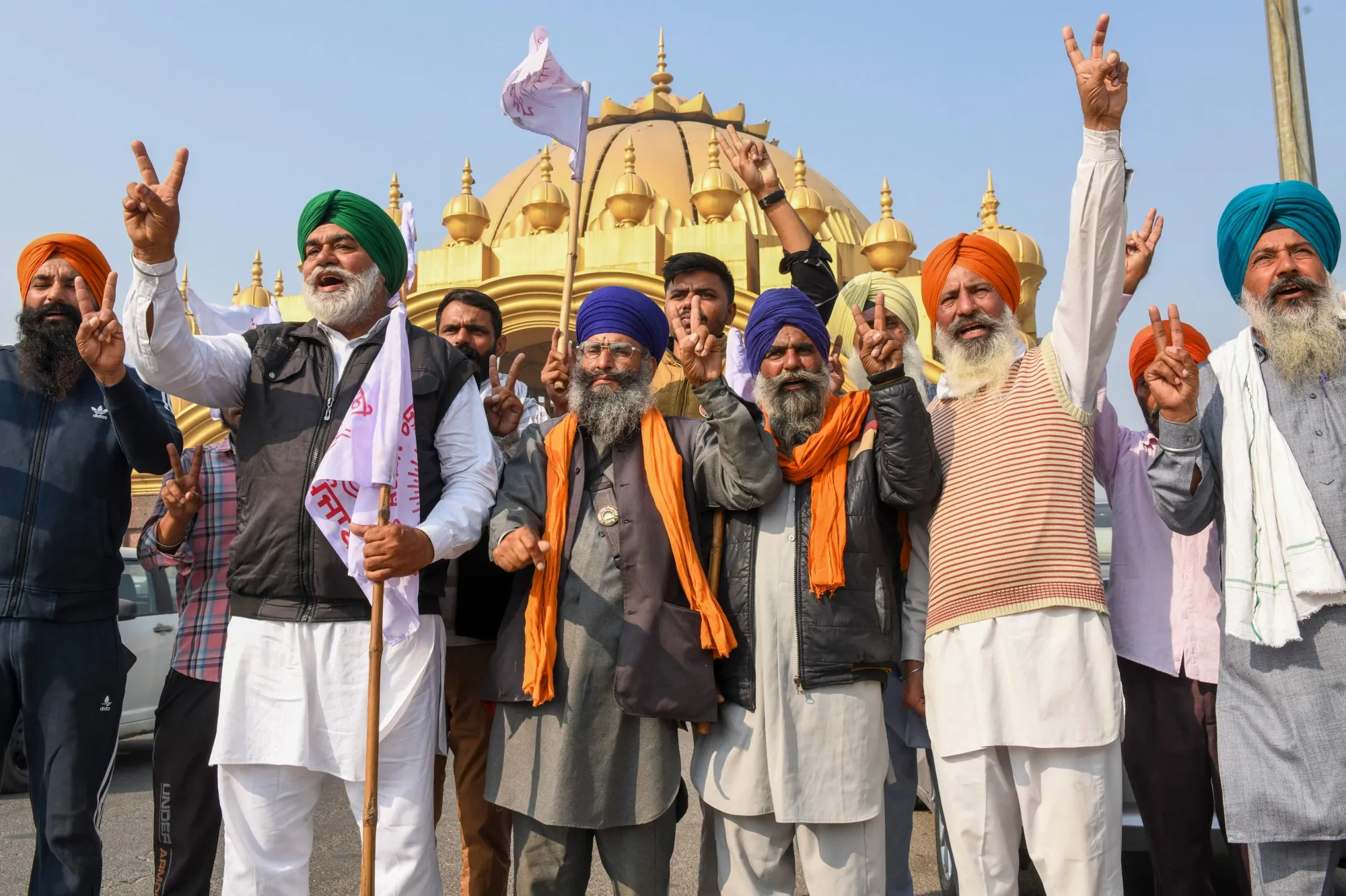 Farmers&nbsp;celebrate as Narendra Modi announces&nbsp;the&nbsp;repeal of agricultural reform laws, in November.