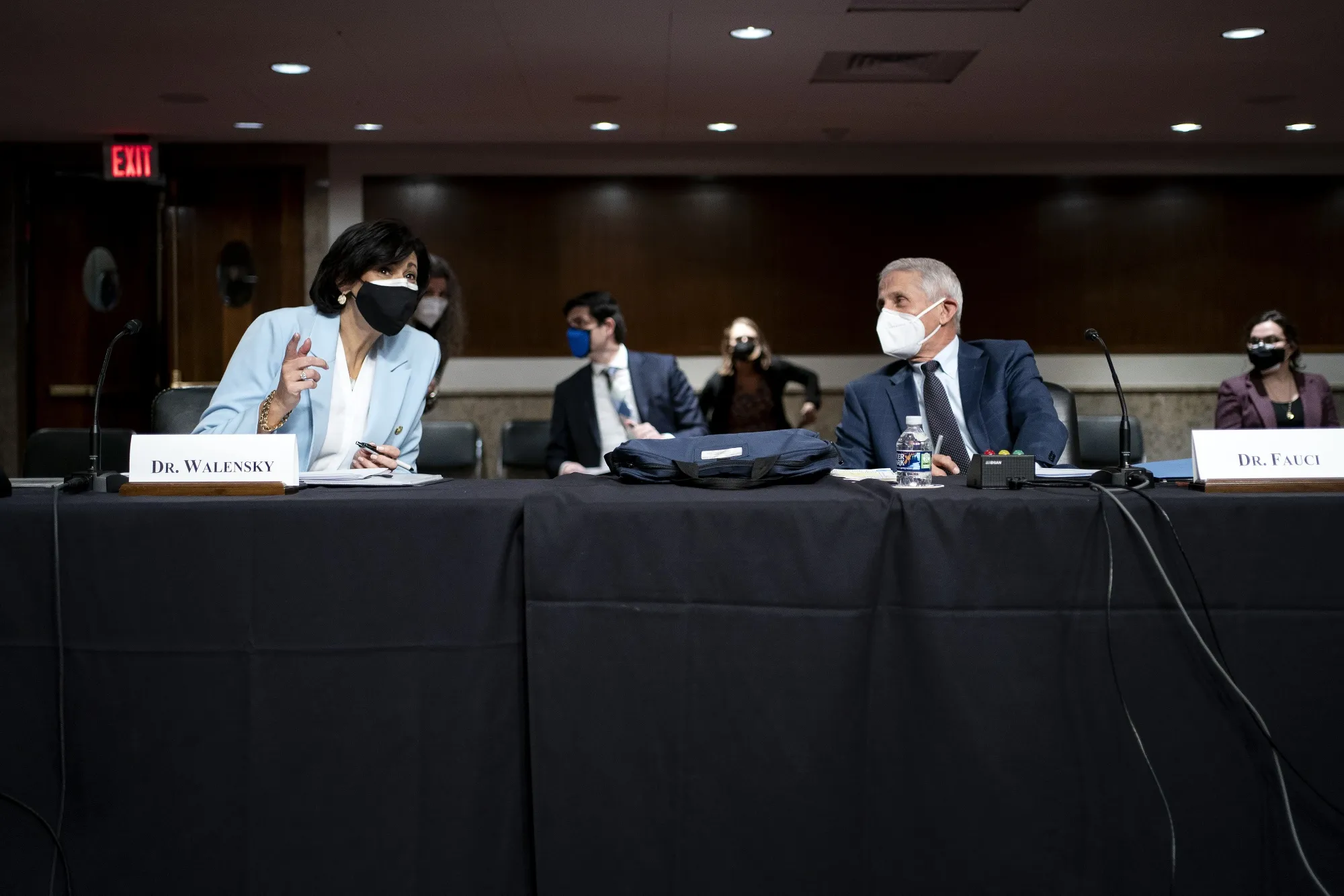 Rochelle Walensky, left, speaks with Anthony Fauci&nbsp;before a Senate Health, Education, Labor, and Pensions Committee hearing on Jan. 11.