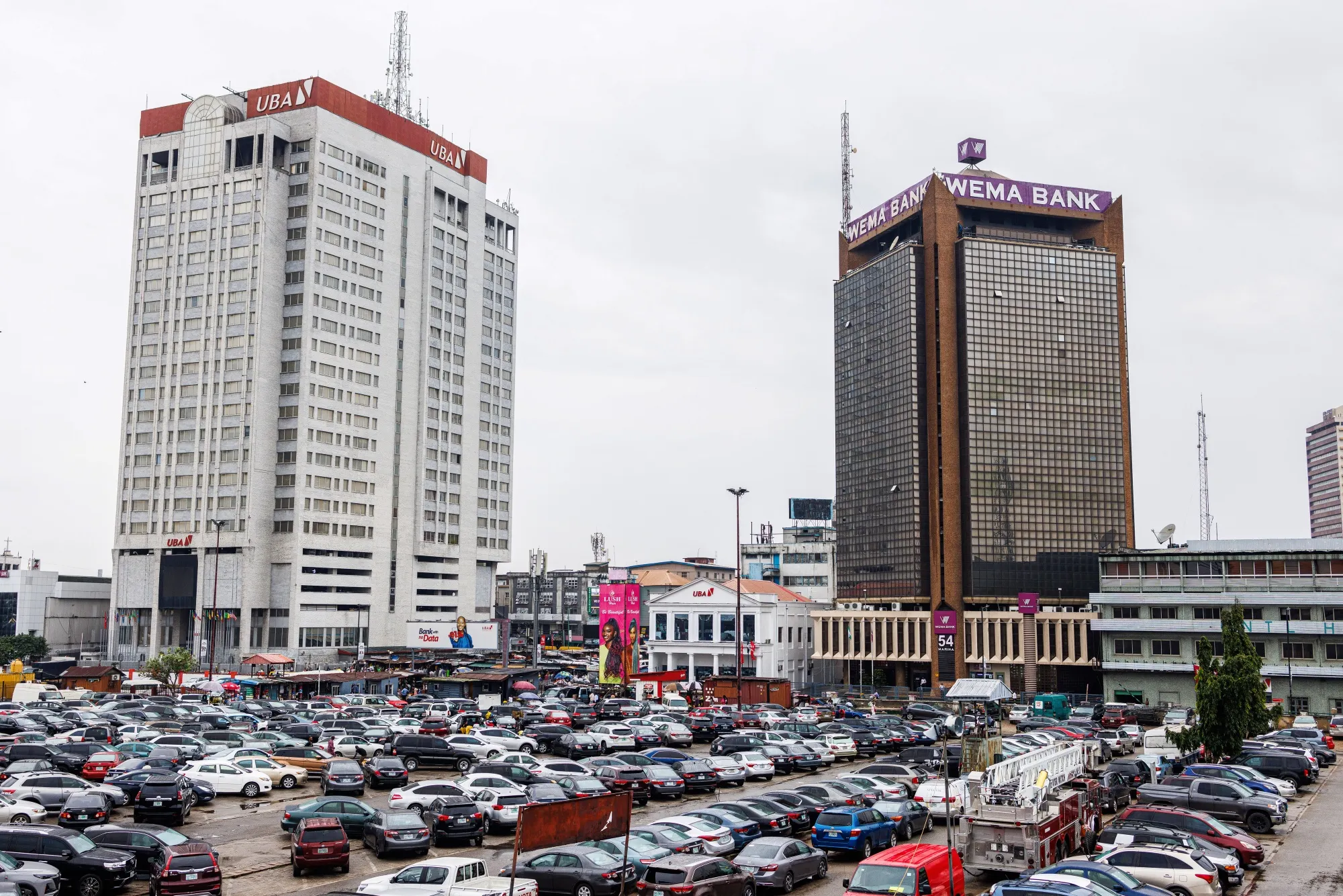 The offices of United Bank for Africa Plc (UBA), left,&nbsp;in the Central Business District (CBD) of Lagos.&nbsp;