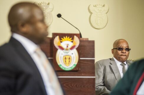 Zuma looks on while van Rooyen is sworn into office, Dec. 10.