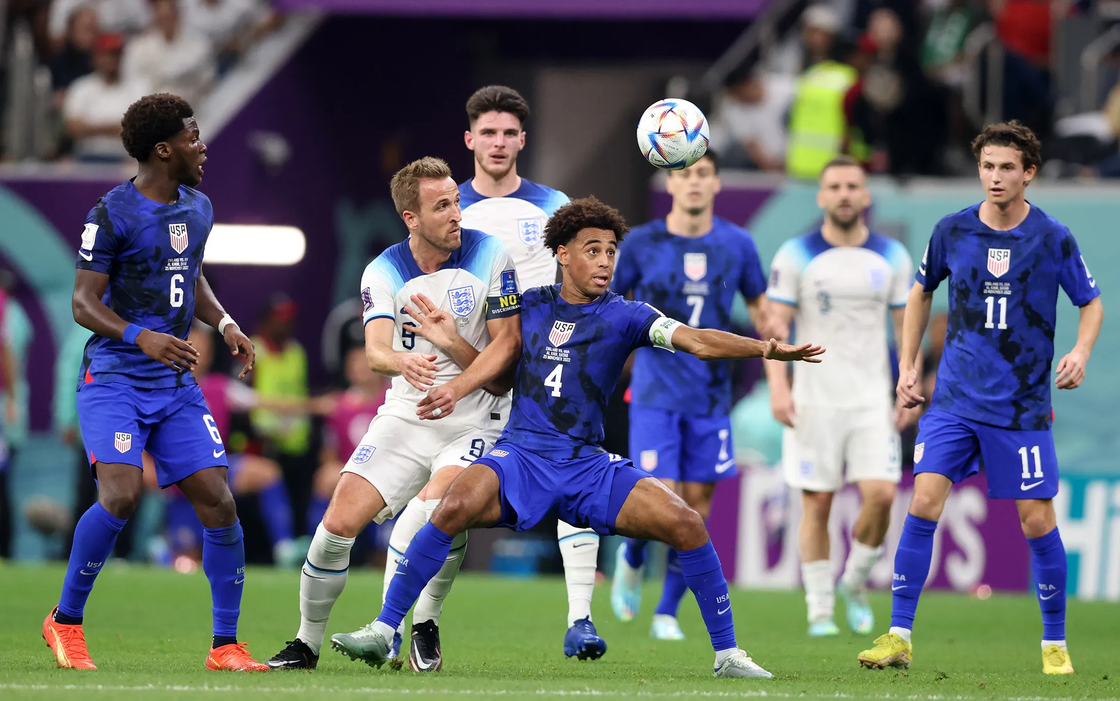 Harry Kane of England vies with Tyler Adams of USA during the FIFA World Cup 2022 match&nbsp;at Al Bayt Stadium in Al Khor, Qatar, on Nov.&nbsp;25.