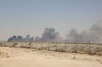 Smoke billows from an Aramco oil facility in Abqaiq on Sept. 14.