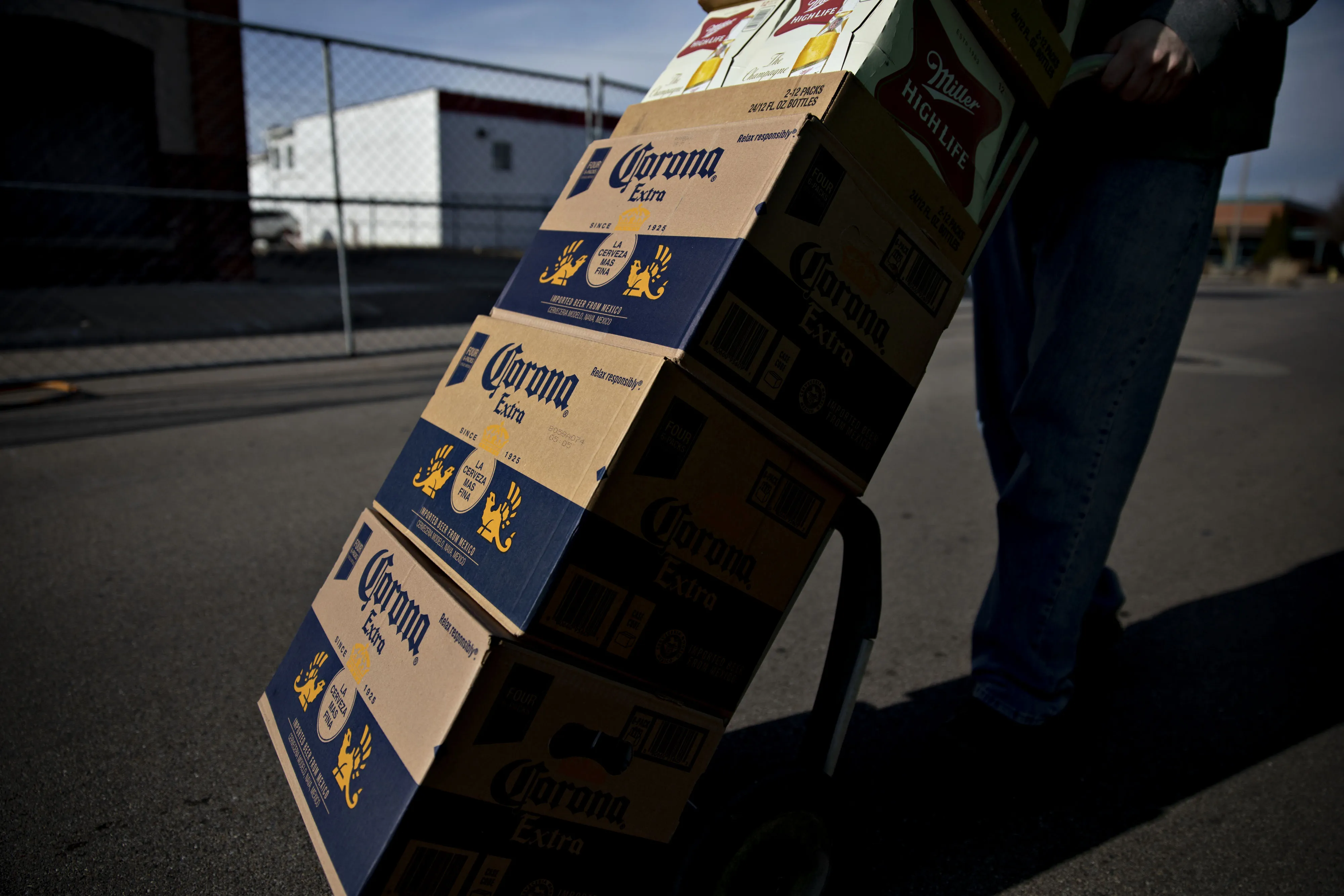 A driver delivers cases of Constellation Brands Inc. Corona beer.