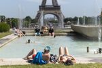 People sunbathe at the Trocadero esplanade fountain&nbsp;in Paris,&nbsp;2019.