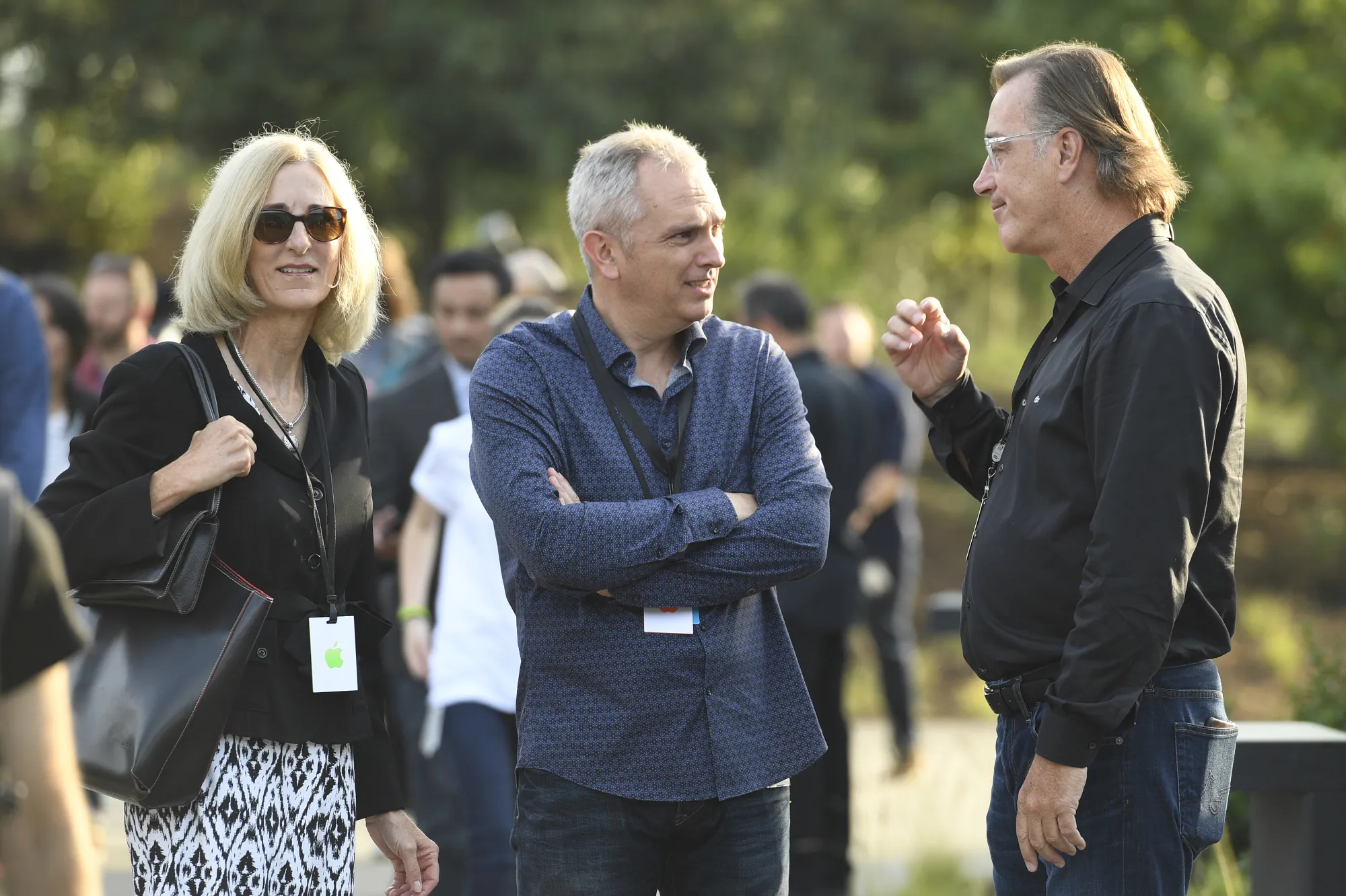 Maestri, center, at an Apple product launch event.