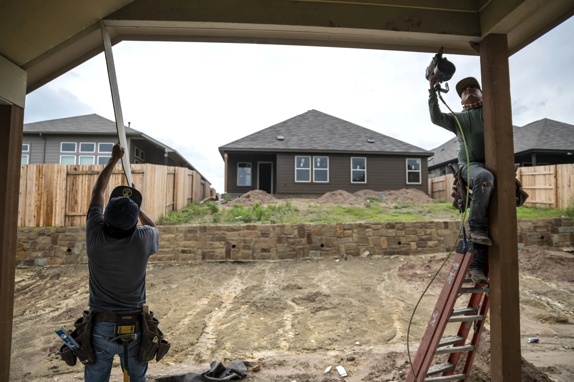 Workers add boards to the exterior of a home at a construction site in a new residential development near Buda, Texas,&nbsp;on Wednesday, May 15, 2021.

Sergio Flores/Bloomberg