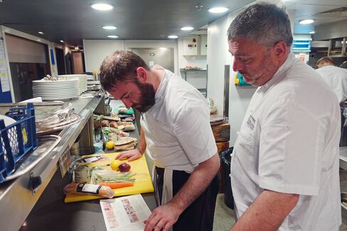 Richard Corrigan (right) studies the Marley Spoon recipe with his head chef, Alan Barrins.