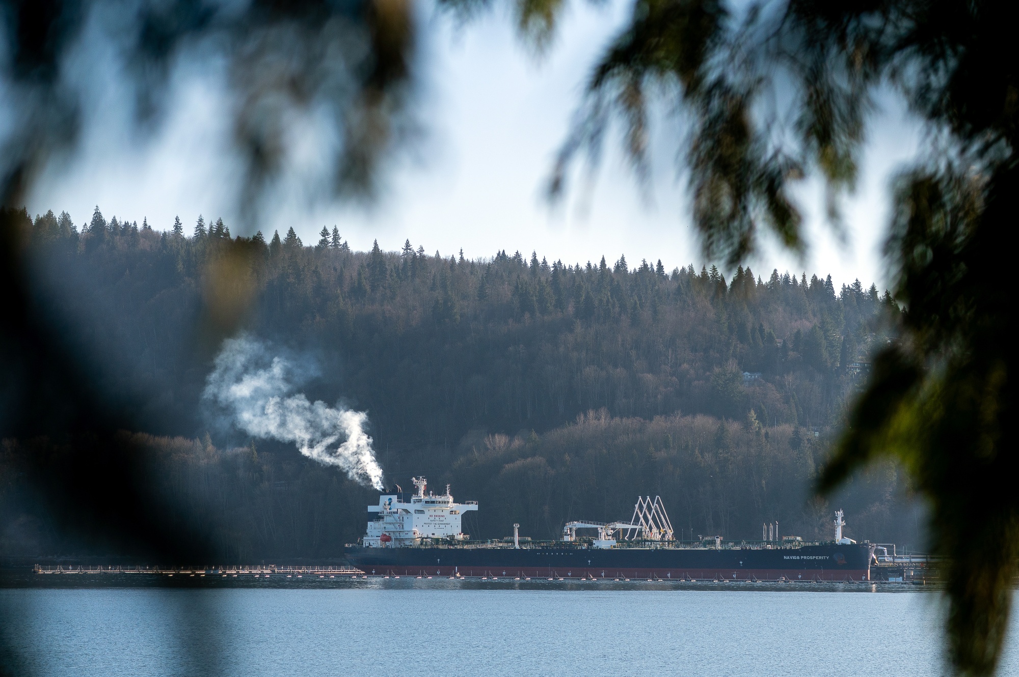An oil tanker is loaded at the Westridge Marine Terminal at the end point of the Trans Mountain Pipeline System in Burnaby, British Columbia, Canada, on Sunday, Jan. 26, 2025. A project to triple the capacity of the Trans Mountain Pipeline still has a high value after massive cost overruns to build it, Canada's government spending watchdog concluded.