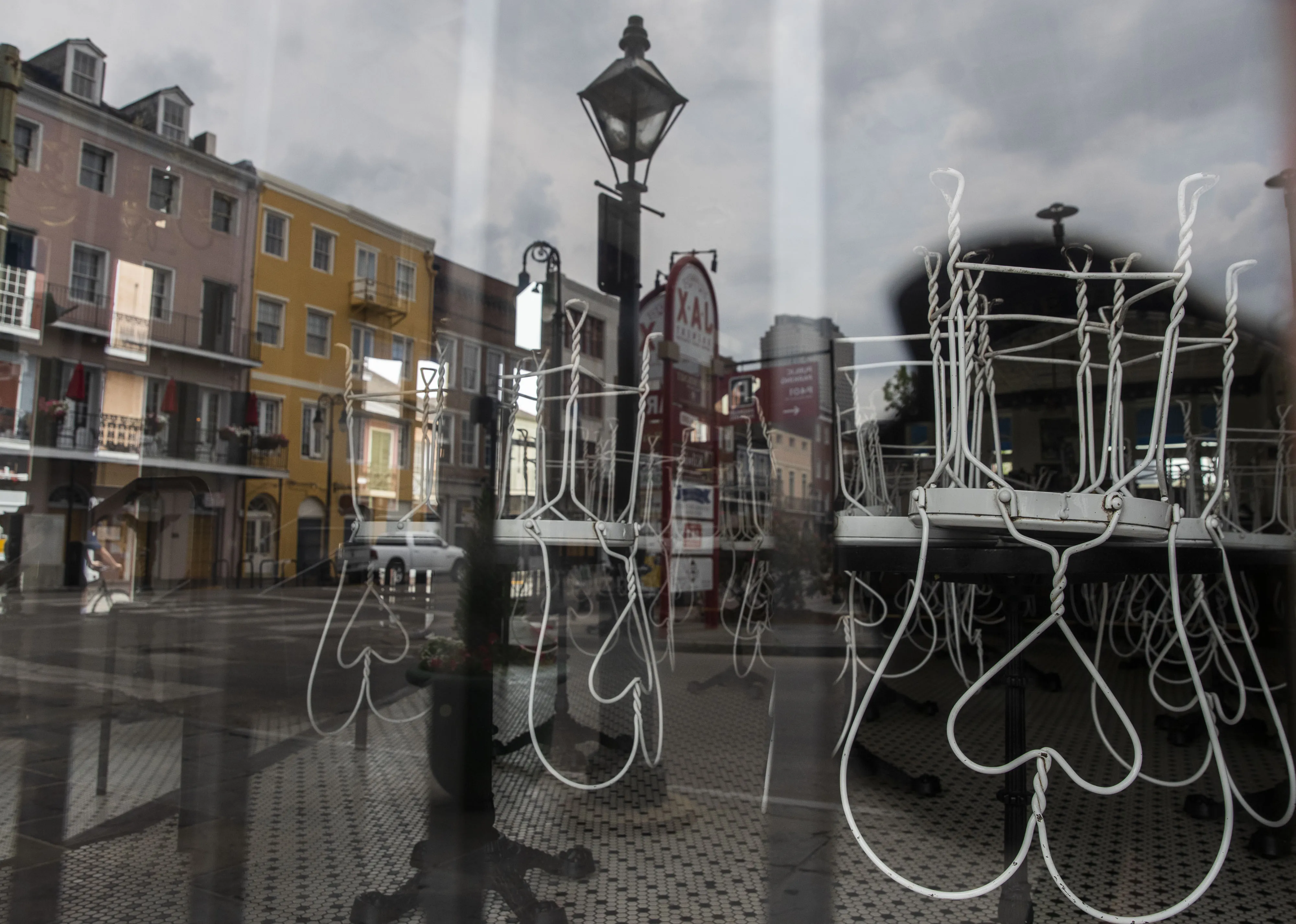 Chairs sit on the tables of a closed cafe in the French Quarter neighborhood of New Orleans on April 8.