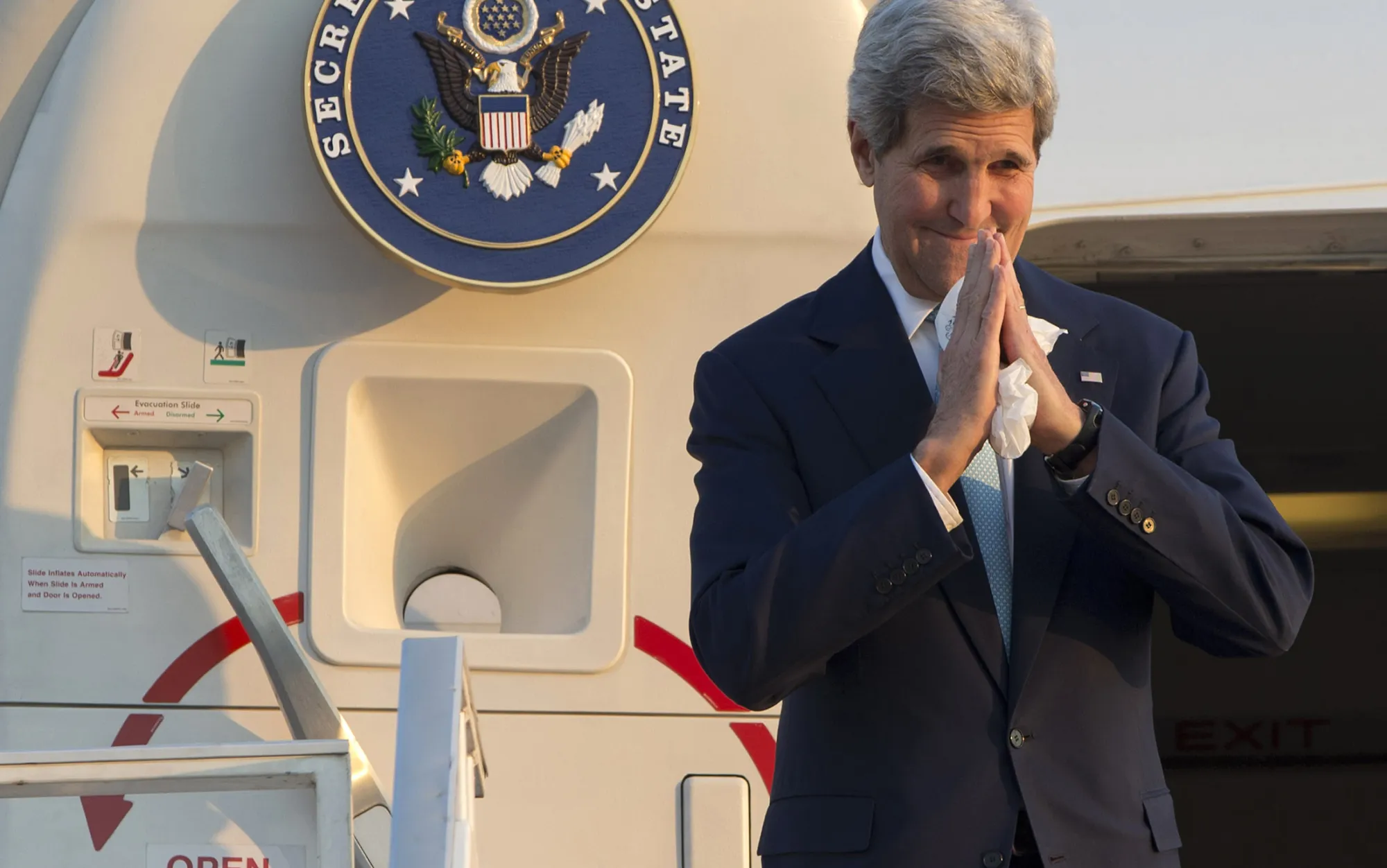 U.S. Secretary of State John Kerry gestures as he leaves Phnom Penh, Cambodia, en route to China, on Jan. 26.
