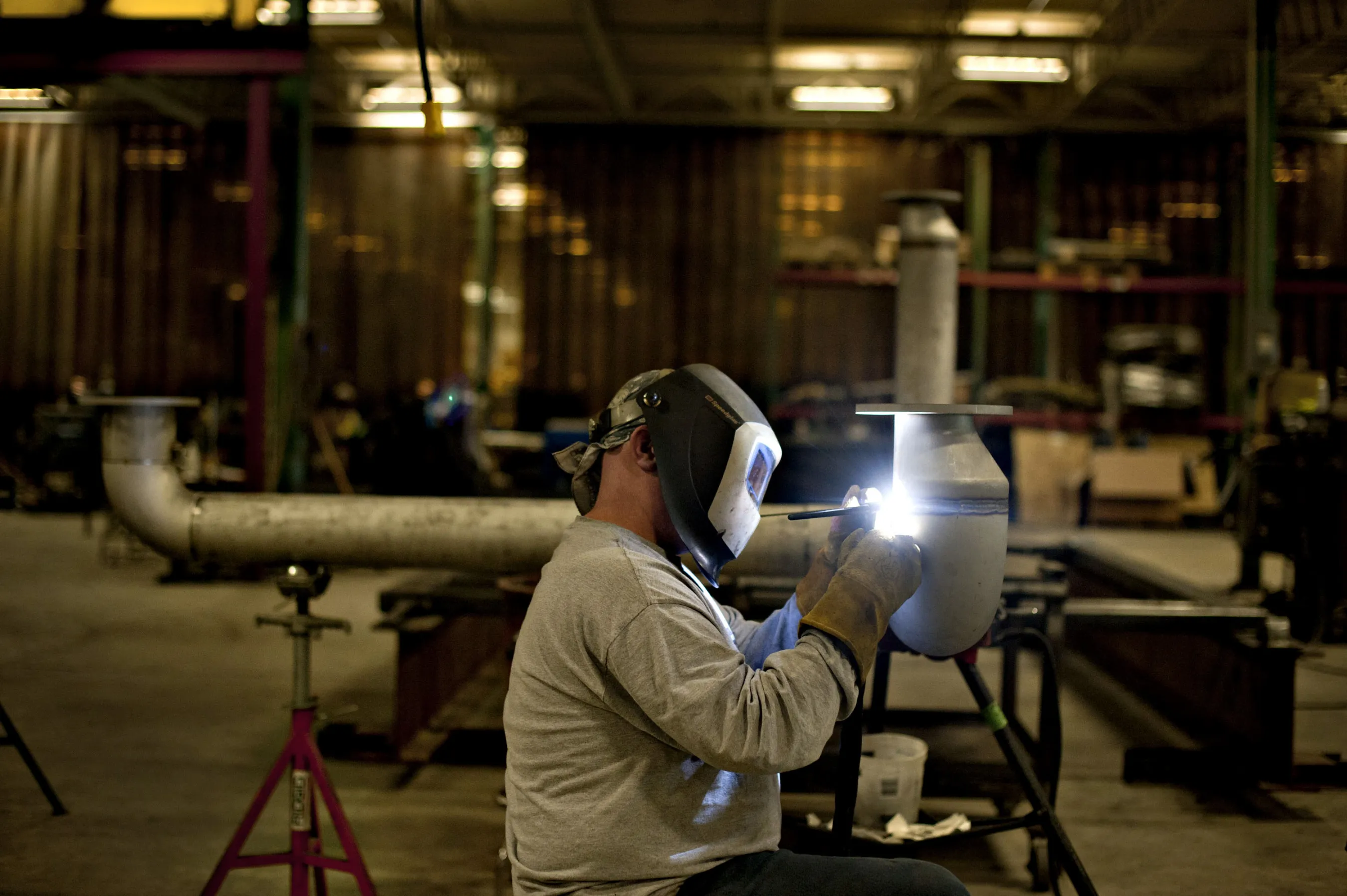 A worker welds a stainless steel gas pipe&nbsp;in East Peoria, Illinois.