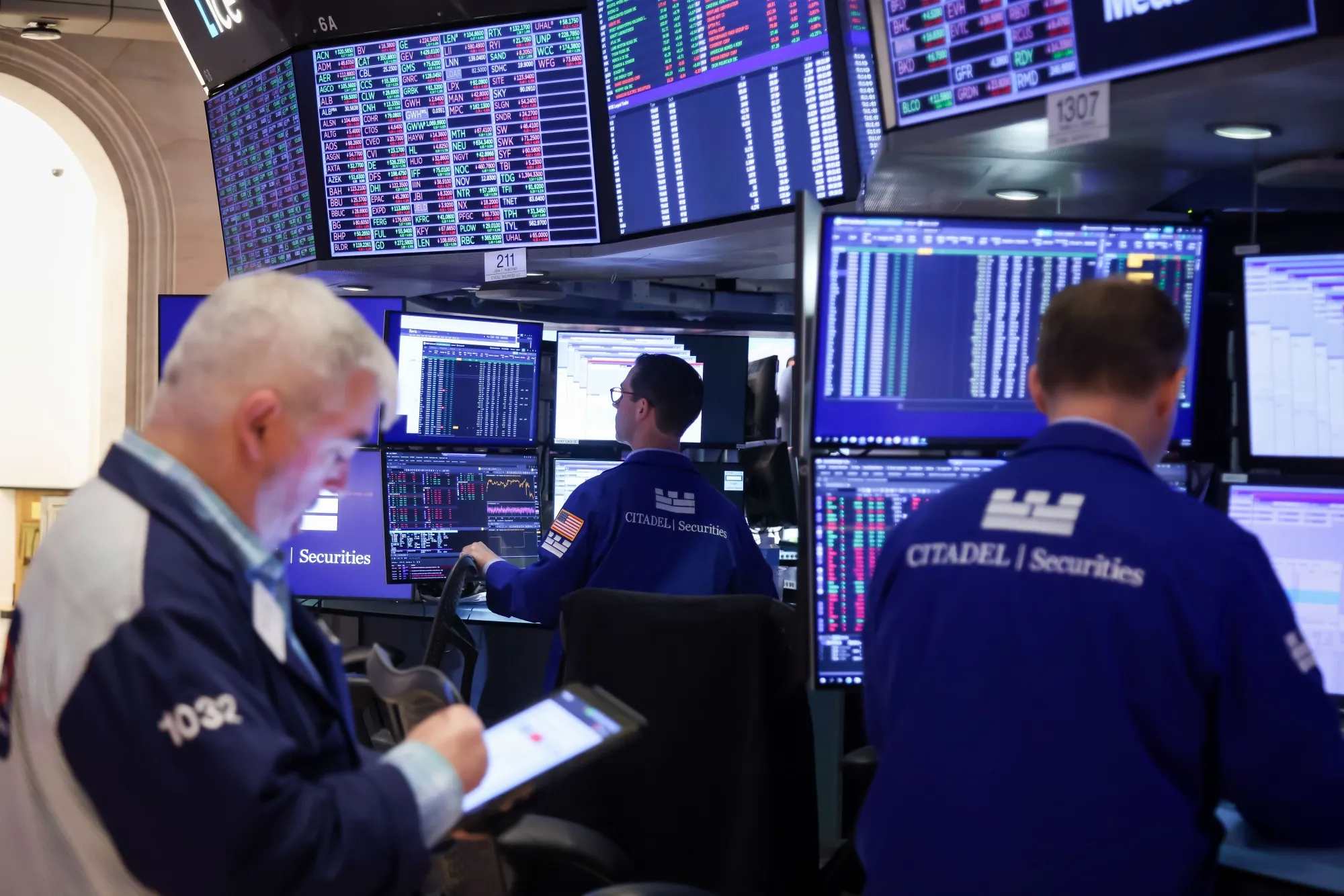 Traders work on the floor at the New York Stock Exchange.