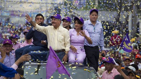 Danilo Medina waves to supporters.