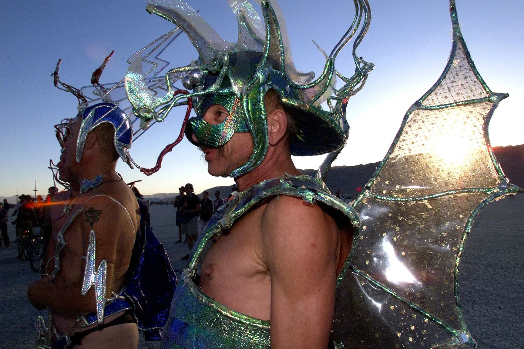 Two men in costume walk on the desert at the&nbsp;Burning Man festival in Nevada.