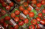 Packs of tomatoes sit on display inside a Albert Heijn XL store, operated by Royal Ahold NV, in Leidschendam, Netherlands, on Wednesday, Feb. 18, 2015. Ahold is scheduled to report its full fourth-quarter and full-year results on Feb. 26.