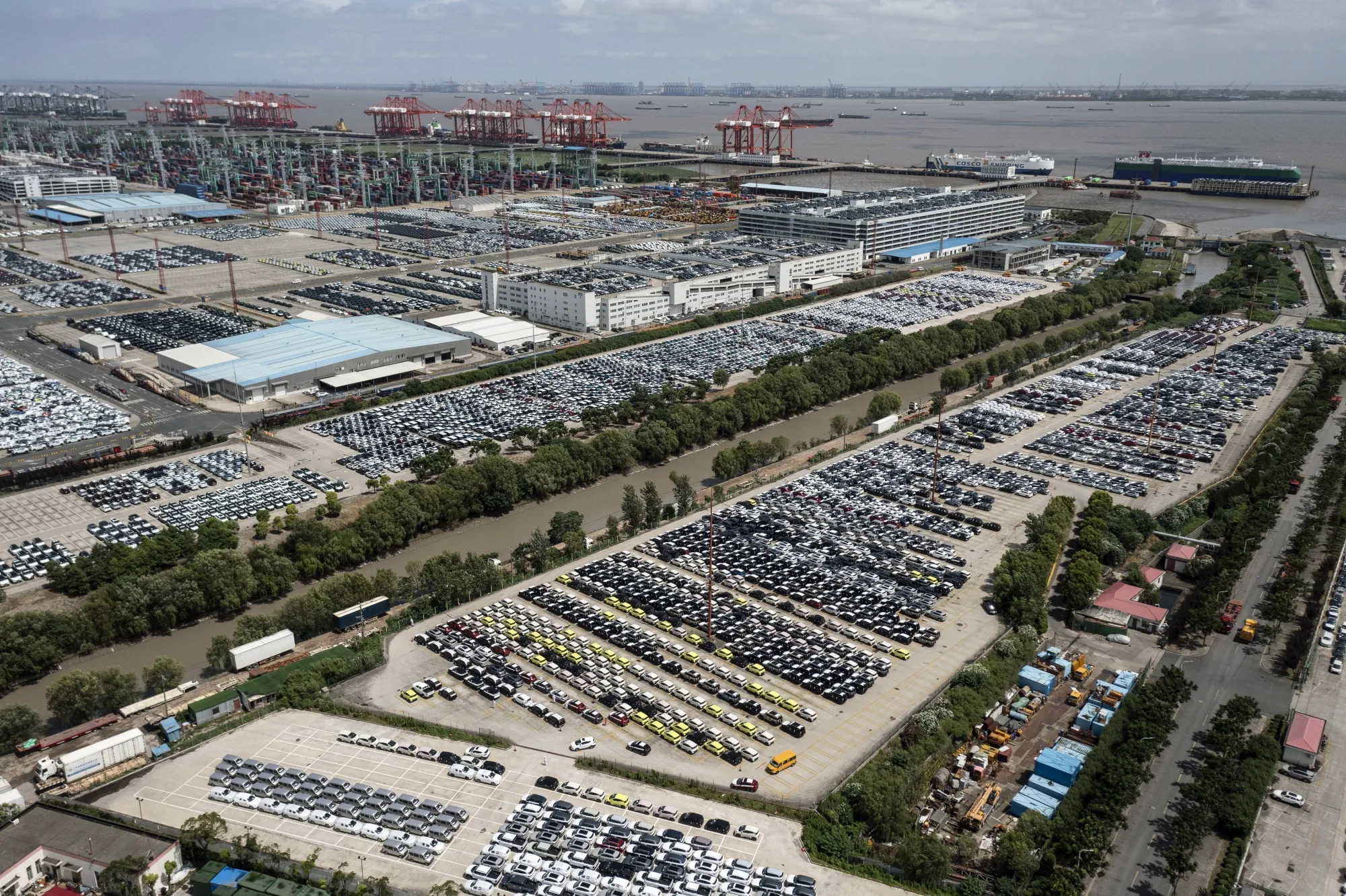 Vehicles waiting for shipment at a lot of a shipping terminal in Shanghai, China.