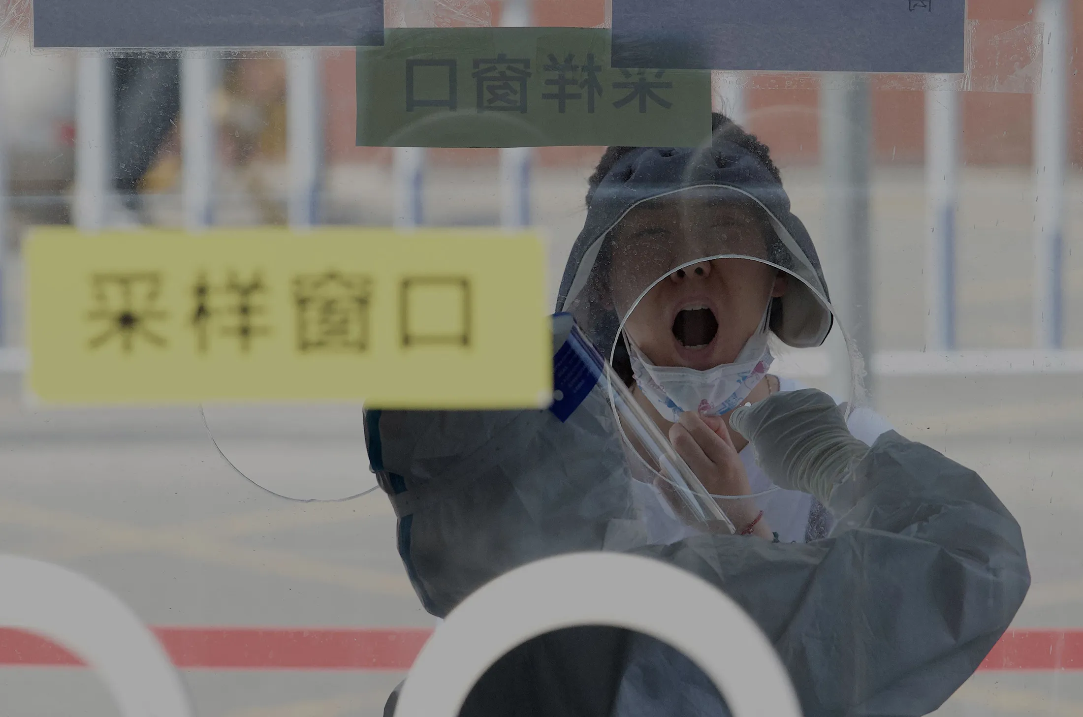 A health worker takes a swab sample in Beijing on May 19.
