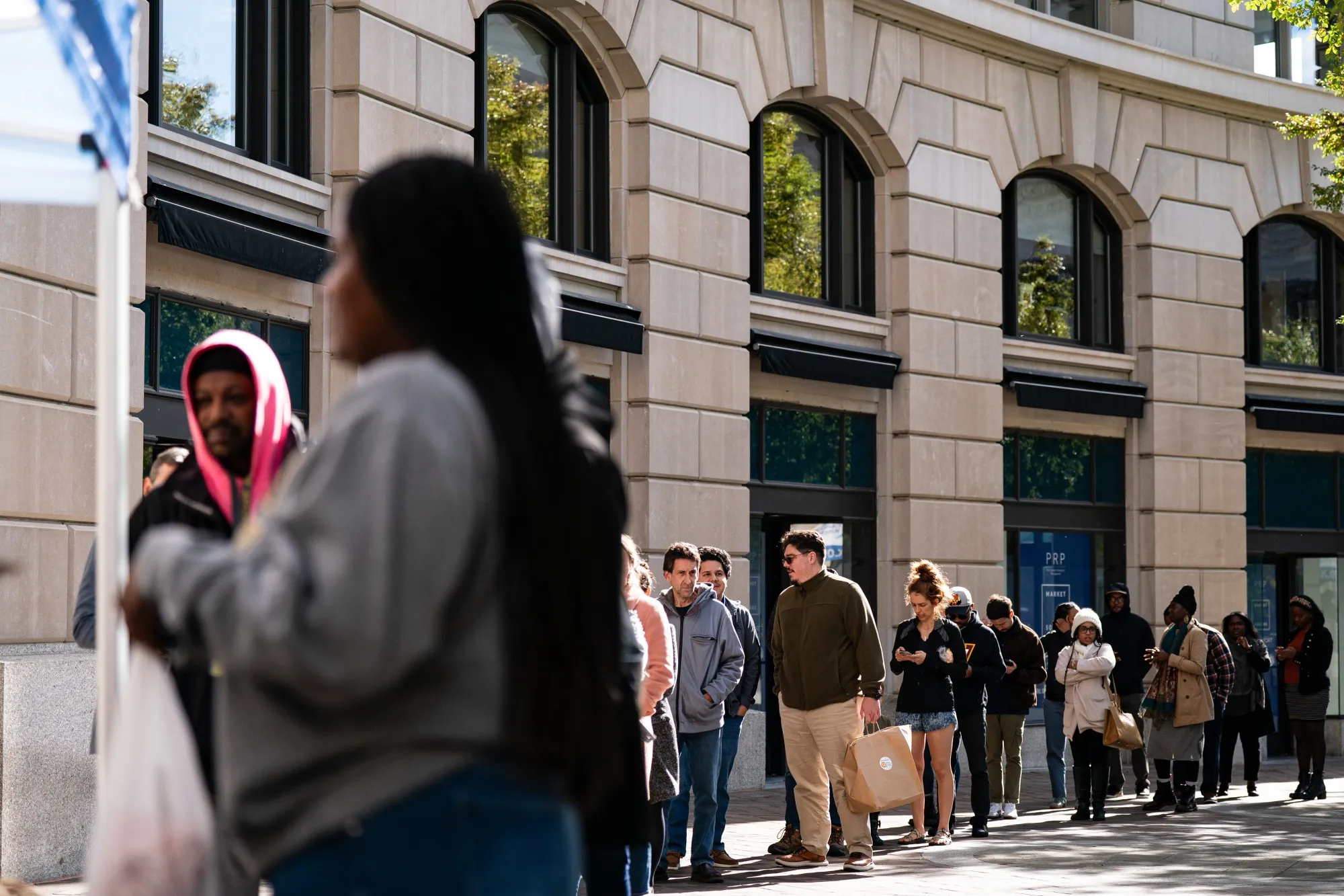 Residents wait in line at a&nbsp;meal distribution site for furloughed federal workers in Washington on Oct. 31.