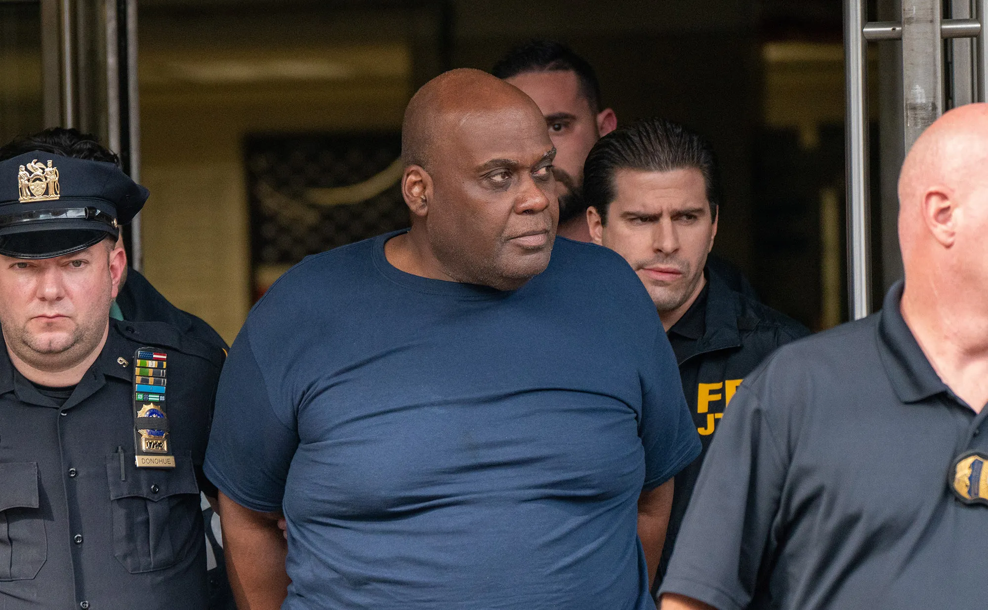 Frank James is escorted out of the 9th Precinct by police after being arrested in New York on April 13.