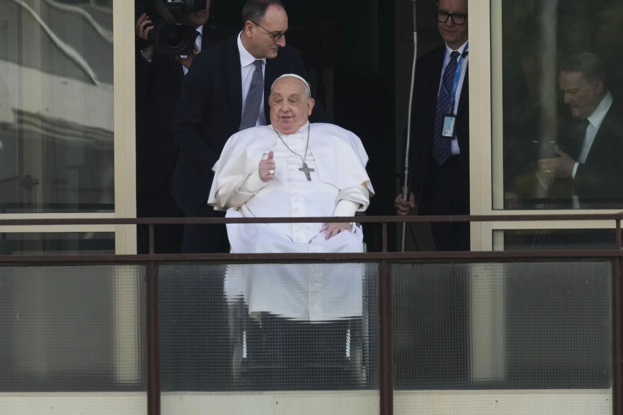 Pope Francis appears at a window of the Agostino Gemelli Polyclinic in Rome,&nbsp;March 23.