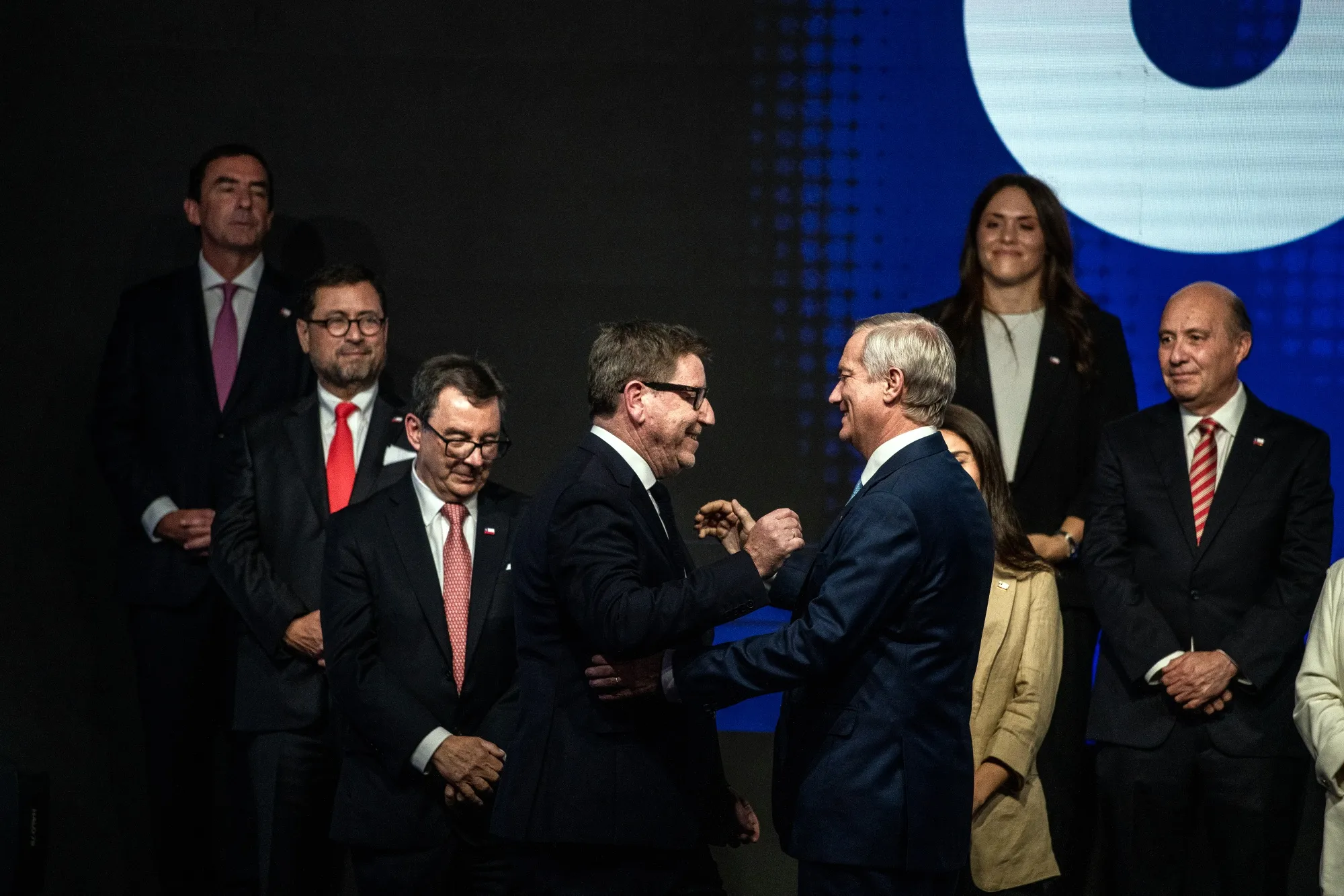 President-elect Jose Antonio Kast, center right, with Daniel Mas, Chile's incoming minister of mining and economy, center left,&nbsp;in Santiago, on Jan. 20.