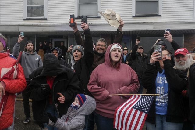 Residents of East Palestine, Ohio, cheer the arrival of former US President Donald Trump, not pictured. 