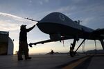Maintenance personnel near the Mexican border check a Predator drone operated by the U.S. Office of Air and Marine 