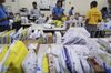 Abdul Saleem, a deliveryman known as a Wishmaster for Flipkart Online Services Pvt's Ekart Logistics service, center, sorts packages at the company's office in the Jayaprakash Narayan Nagar area of Bengaluru, India, on Wednesday, Oct. 26, 2016. Flipkart, India's largest and most valuable e-commerce company, is against domestic rival Snapdeal.com and U.S. leviathan Amazon.com Inc., all tussling for dominance in a market that Morgan Stanley expects to explode more than ten-fold to $137 billion by 2020 from $11 billion in 2013.