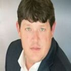 Headshot of John A Baden IV