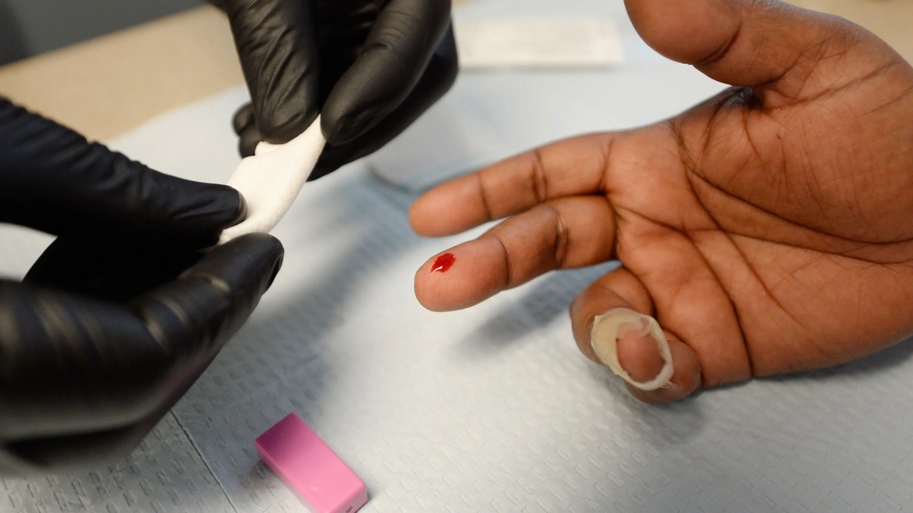 A woman gets an istant HIV/AIDS test inside a moblile clinic of John Wesley Community Health Institute during a health fair sponsored by World Literacy Crusade and the American Health and Education Clinics at the Church of Scientology community center on June 5, 2013 in Los Angeles, California.
