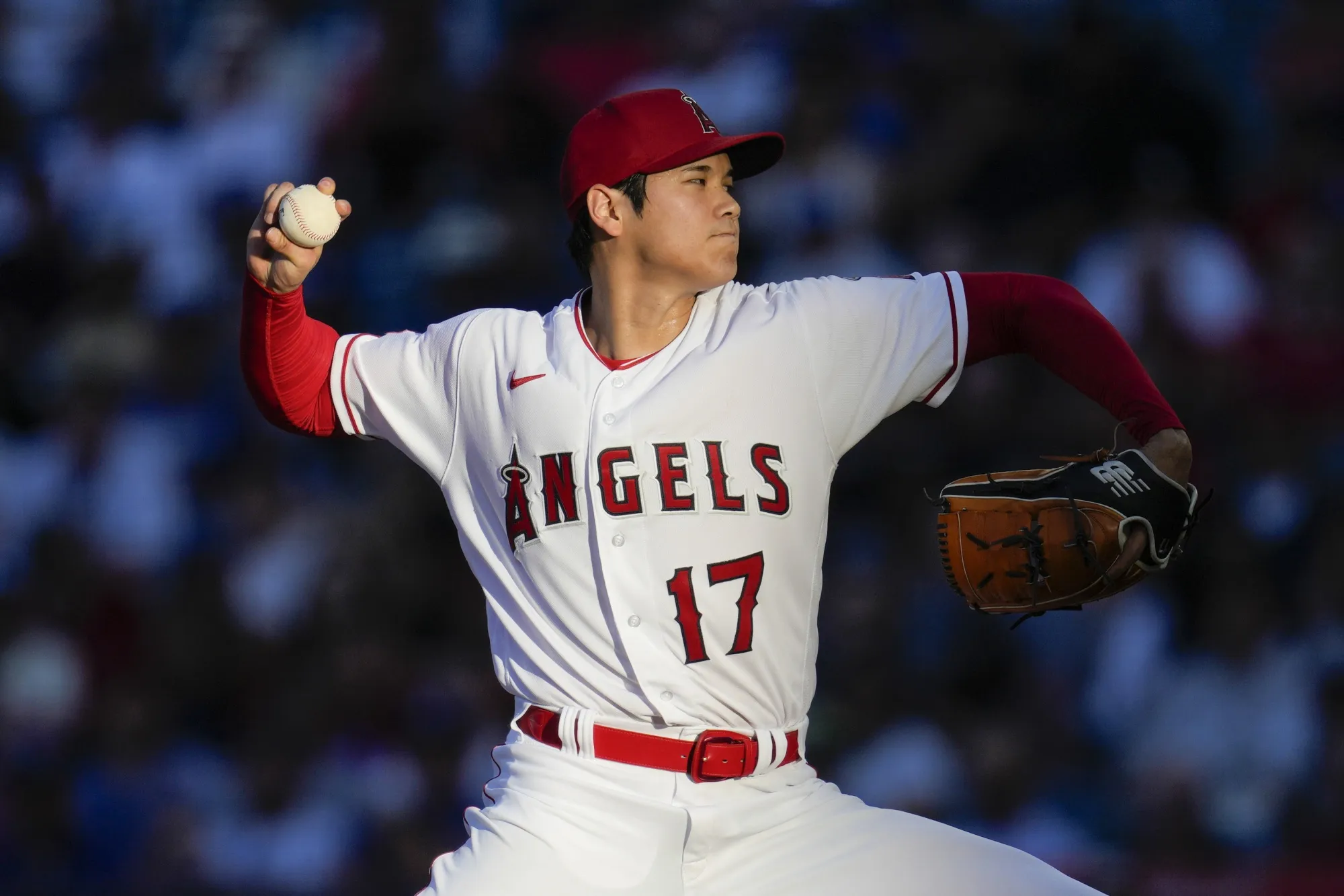 Los Angeles Angels starting pitcher Shohei Ohtani throws during a baseball game against the Los Angeles Dodgers in Anaheim, Calif., June 21, 2023. Ohtani agreed Saturday, Dec. 9, to a record $700 million, 10-year contract with the Dodgers. (AP Photo/Ashley Landis, File)