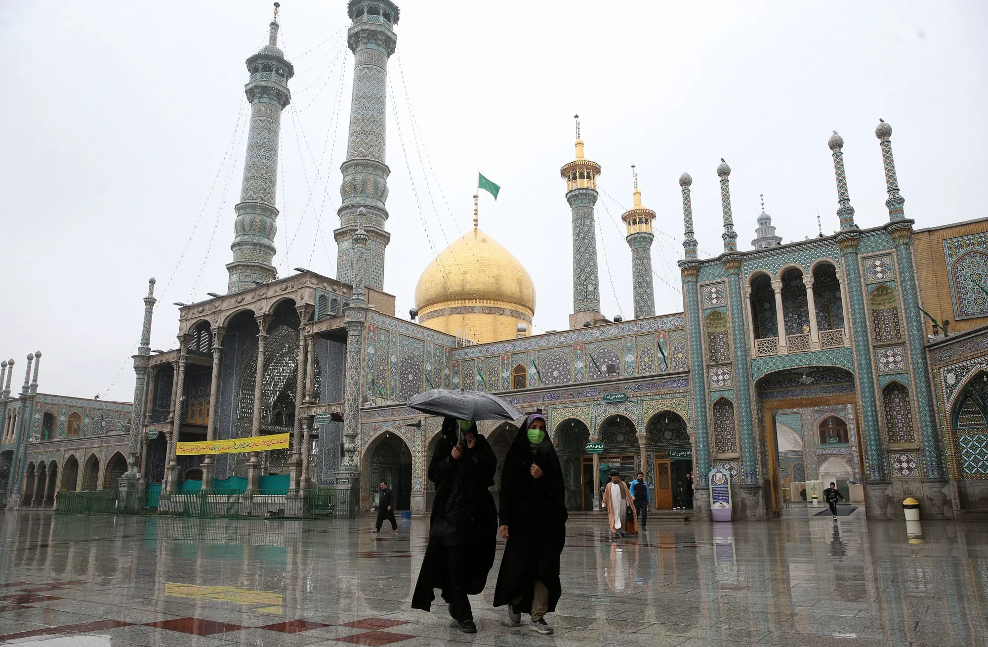 People wear face masks&nbsp;in Qom.&nbsp;