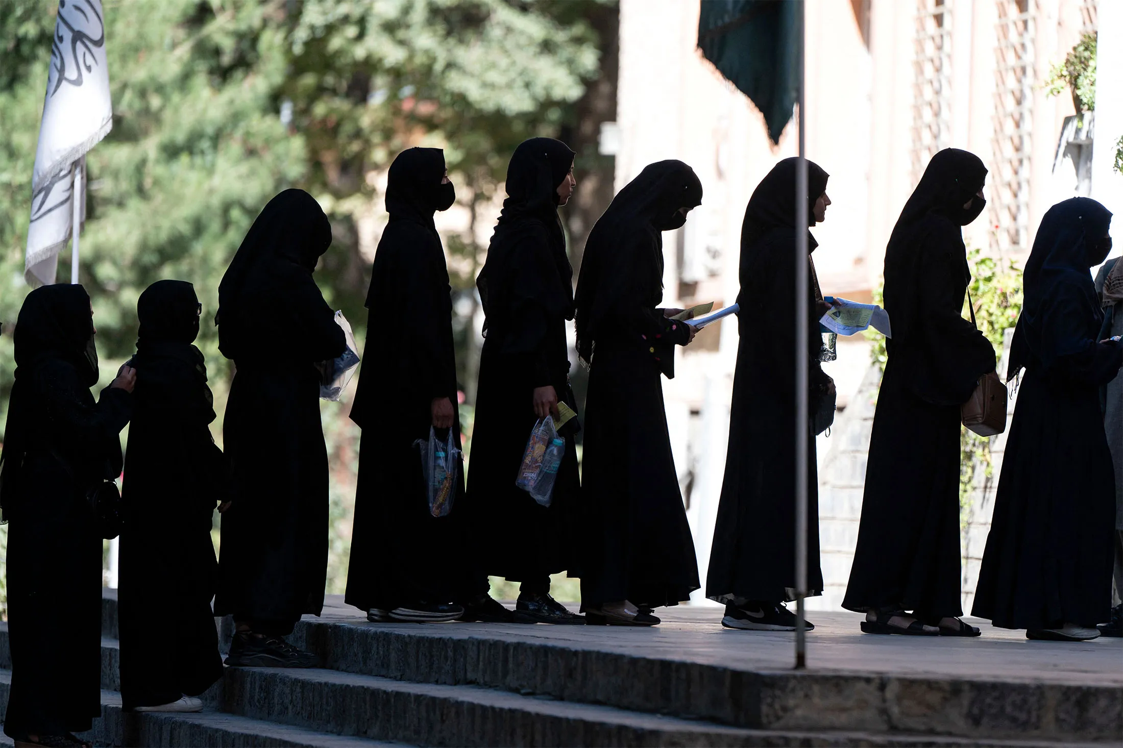 Female students arrive for entrance exams at Kabul University on Oct. 13, 2022.&nbsp;