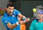 Novak Djokovic of Serbia returns a shot to Feliciano Lopez of Spain,  March 16, 2016 at the BNP Paribas Open at the Indian Wells Tennis Garden in Indian Wells, California.