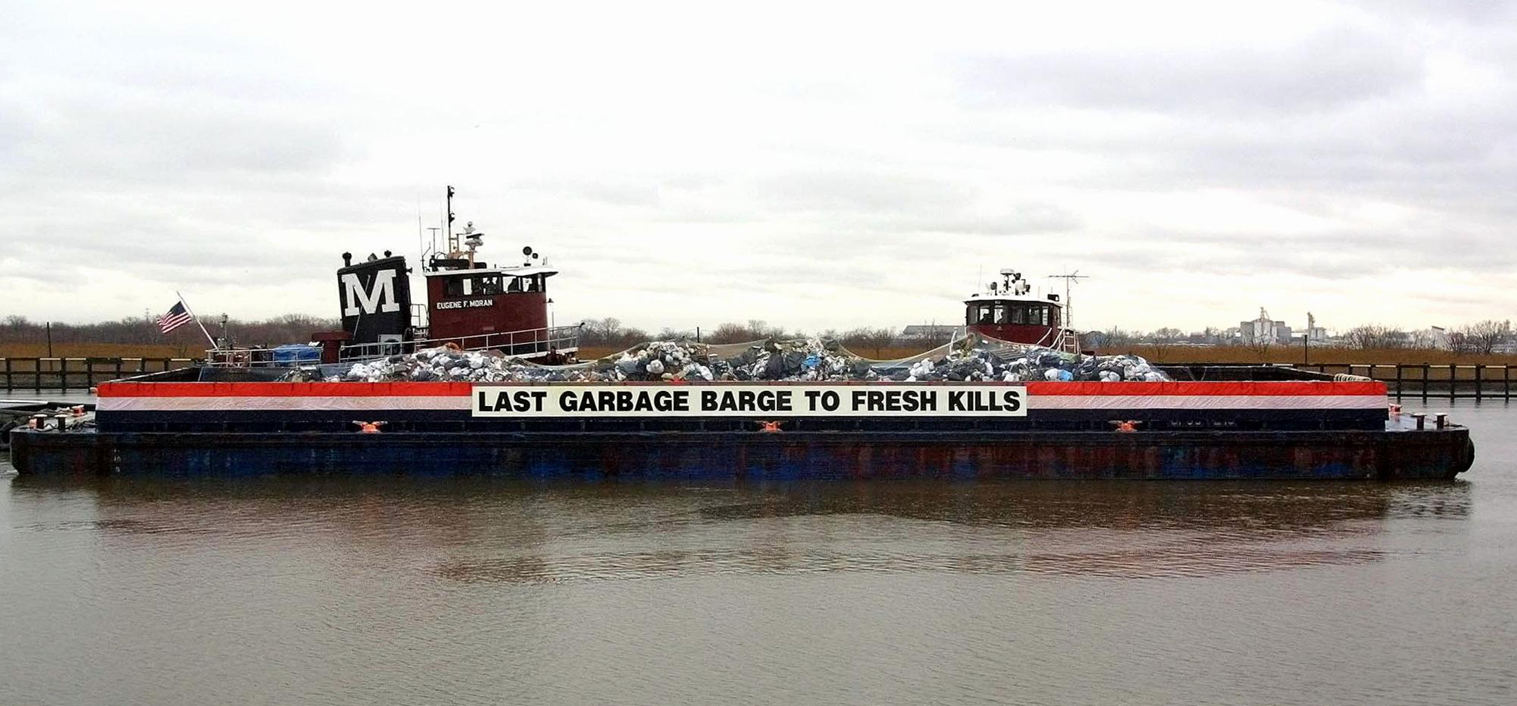 The final barge full of New York City trash arrives at Freshkills