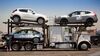 Nissan and Infiniti cars are loaded onto a car carrier at the Port of Los Angeles.