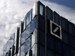 The Deutsche Bank AG logo sits on an office building in Frankfurt, Germany.