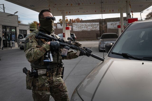 An immigration officer in tactical gear while patrolling in Chicago