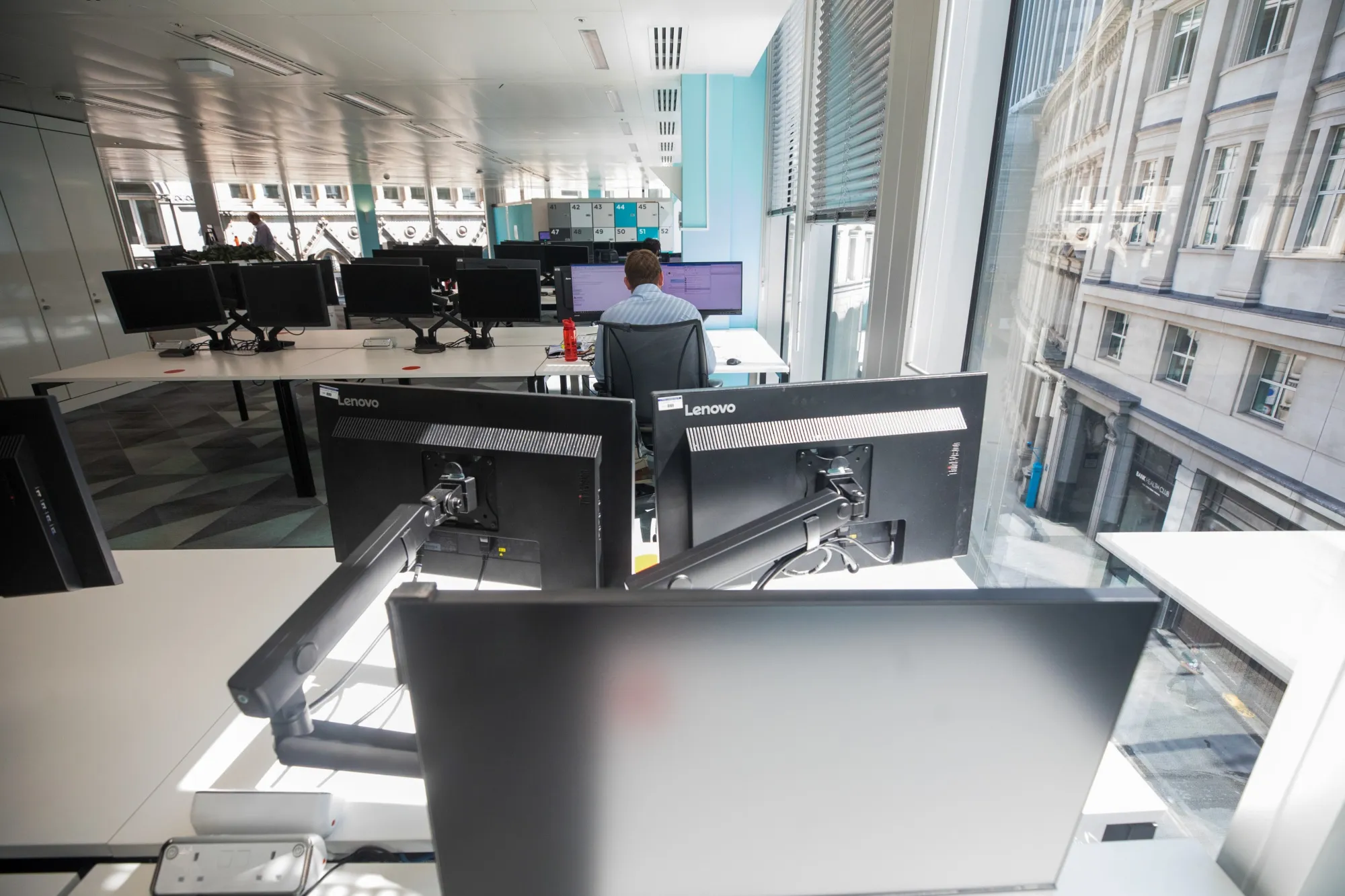An employee sits at his desk at&nbsp;offices&nbsp;in London.